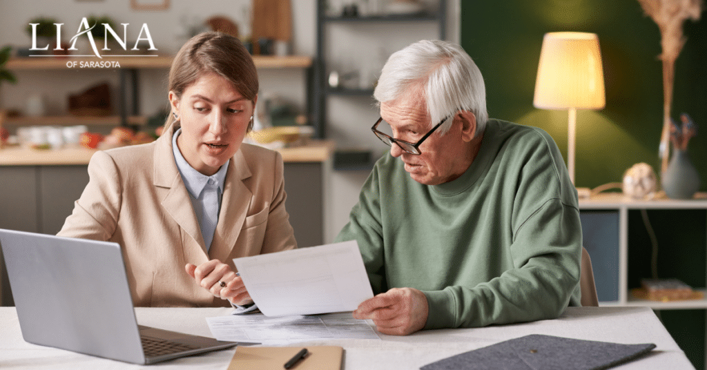 Someone with dementia meeting with a financial advisor to review important documents