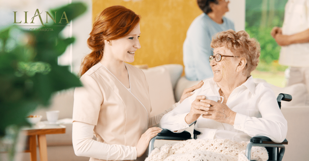 A friendly care partner visiting a senior woman living with dementia