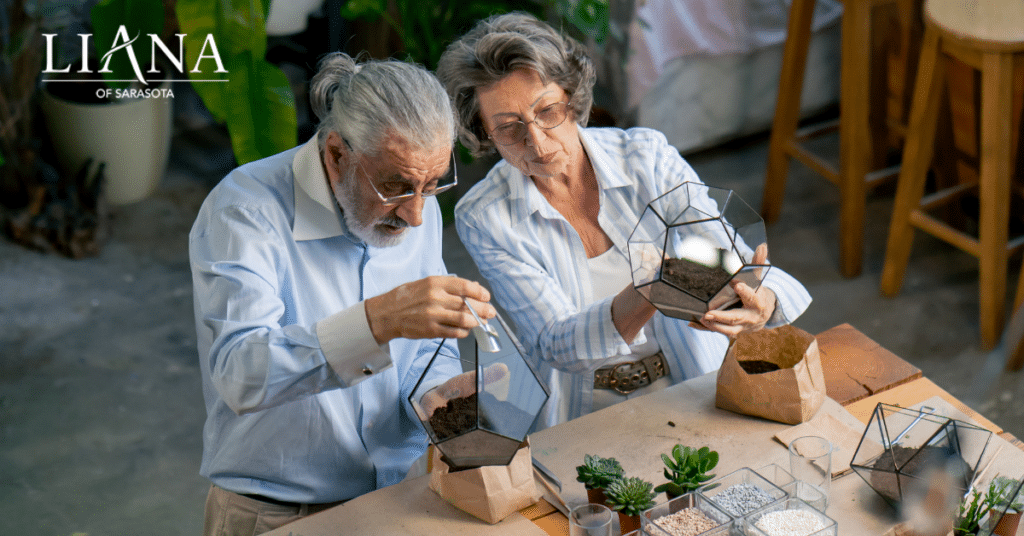 Seniors creating terrariums together as part of sensory activities for seniors in memory care