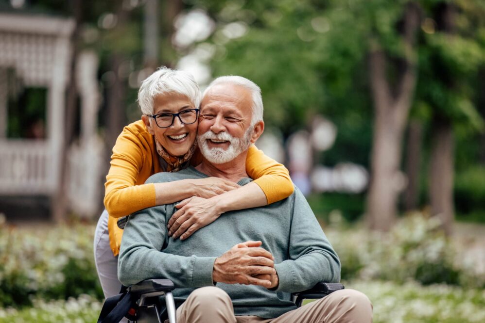 Respite Care. A senior couple having a fun time in the park together.