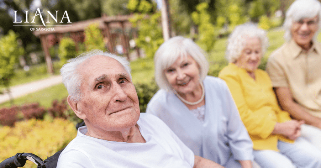 Assisted Living vs Memory Care. Seniors together in the park on sunny day.