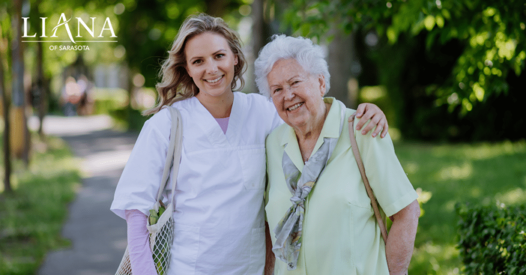 Smiling care partner walking with an older woman during a supportive transition to move a parent with dementia into assisted living.