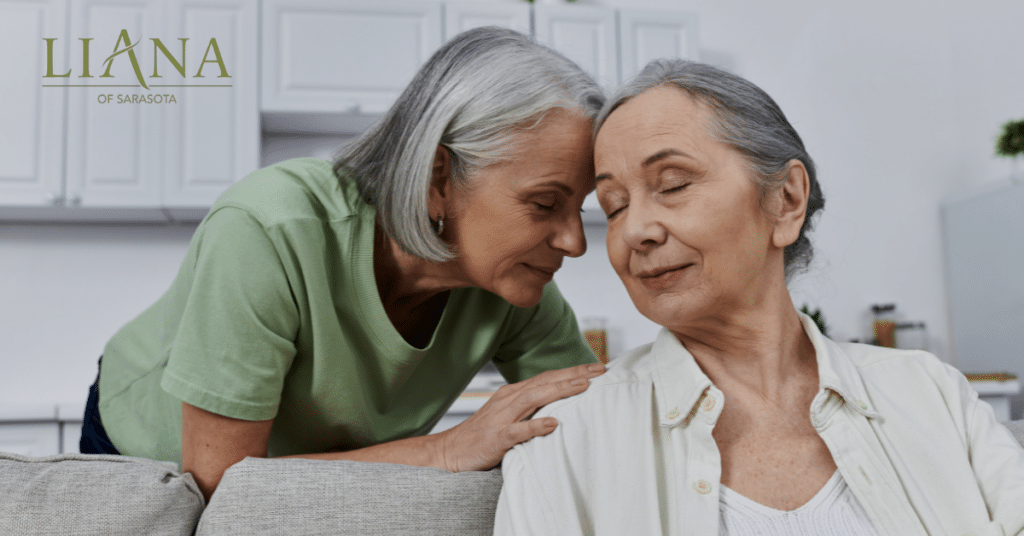 Two older women share a peaceful moment at home, reflecting emotional support and companionship for loved ones who live in hospice.